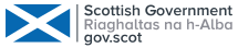 White Text that says "Scottish Government. Riaghaltas na h-Alba. Gov.Scot" with a white silhouette of the Scottish Flag next to it.